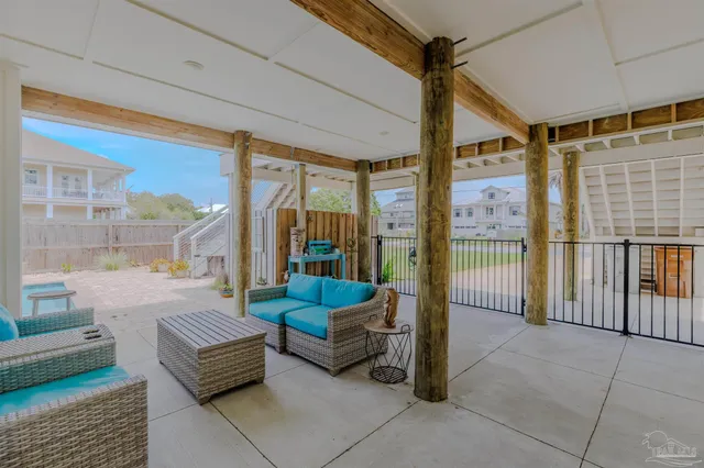 an aerial view of a house with a garden and swimming pool