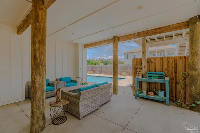 a view of swimming pool with outdoor seating