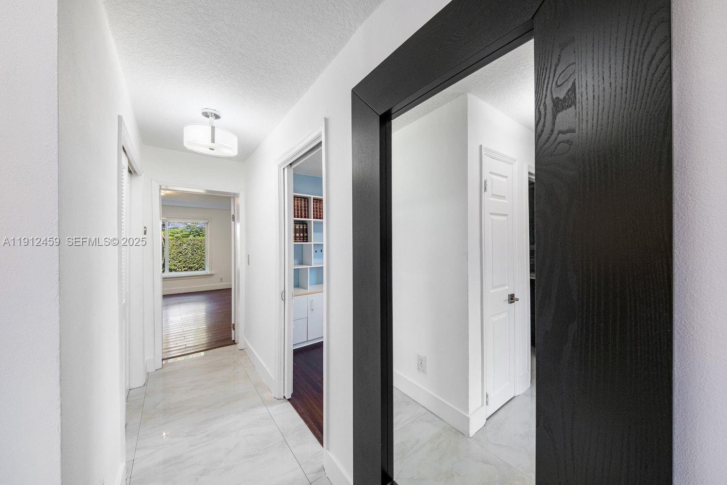 10025 Southwest 83rd Street Miami, FL 33173 - Photo 13 of 37 a view of an empty room and window