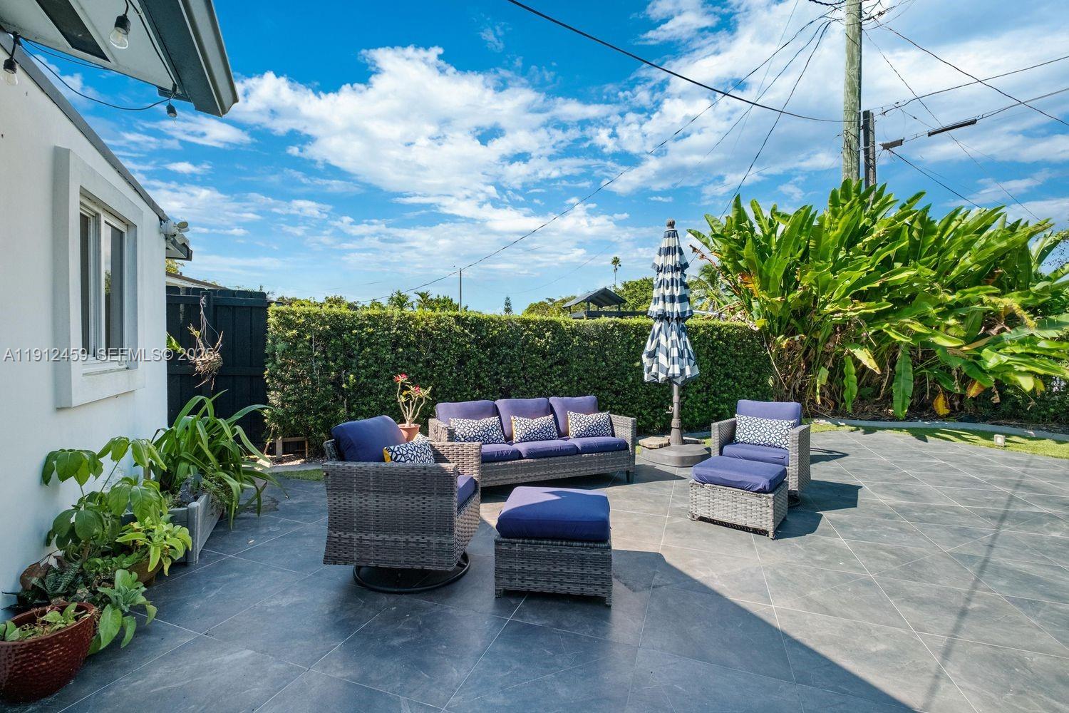 10025 Southwest 83rd Street Miami, FL 33173 - Photo 24 of 37 a outdoor living space with patio furniture