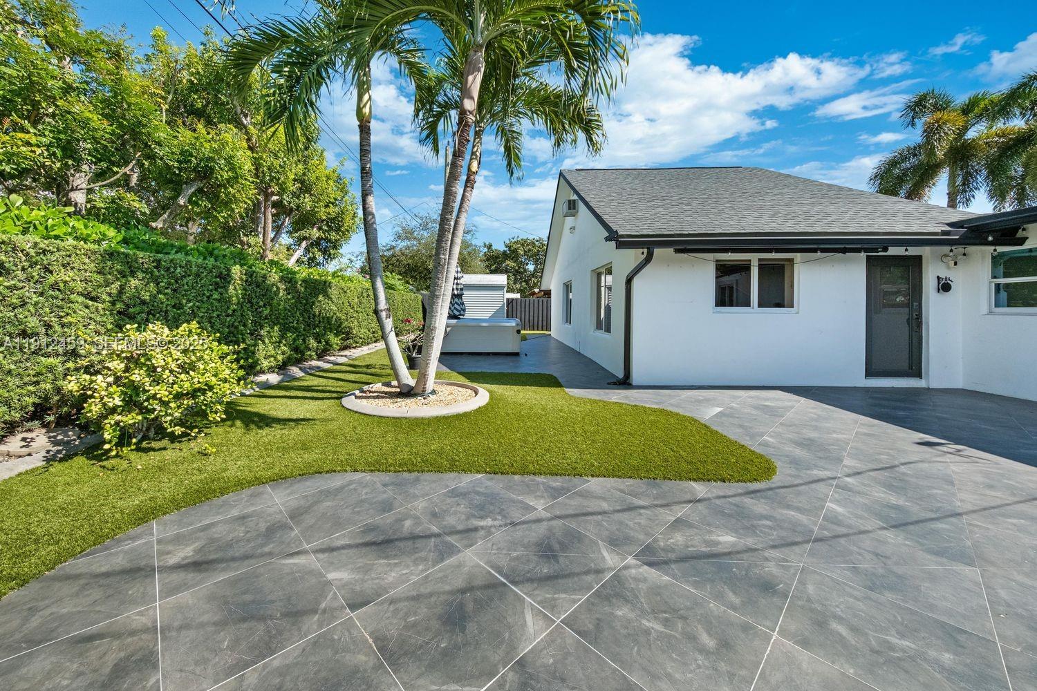 10025 Southwest 83rd Street Miami, FL 33173 - Photo 26 of 37 a front view of a house with garden