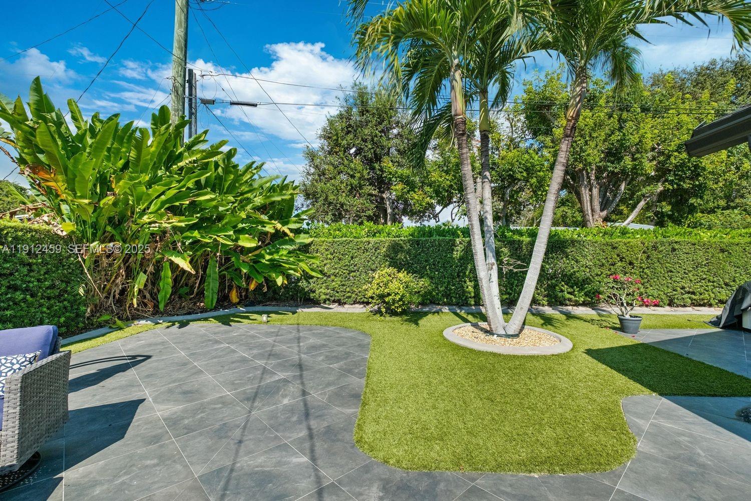 10025 Southwest 83rd Street Miami, FL 33173 - Photo 27 of 37 a view of a garden with a slide
