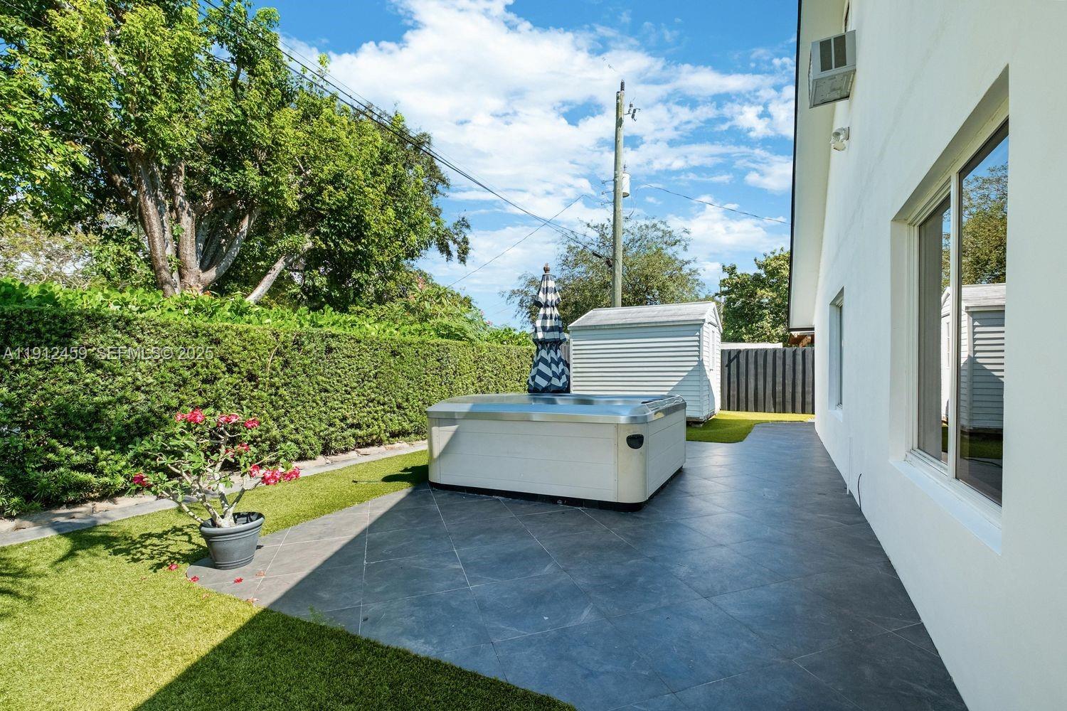 10025 Southwest 83rd Street Miami, FL 33173 - Photo 28 of 37 a view of a back yard with potted plants