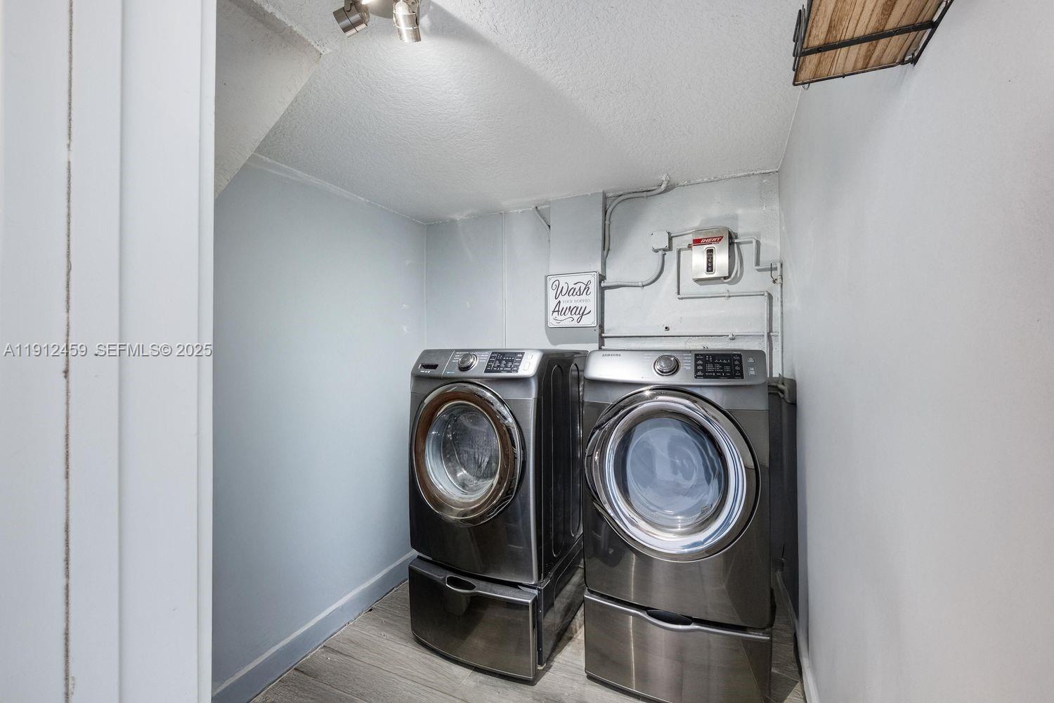 10025 Southwest 83rd Street Miami, FL 33173 - Photo 31 of 37 a utility room with dryer and washer