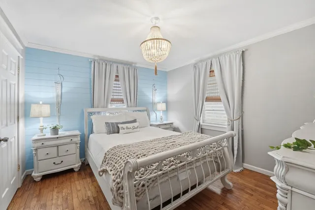 a view of a patio with table and chairs and potted plants
