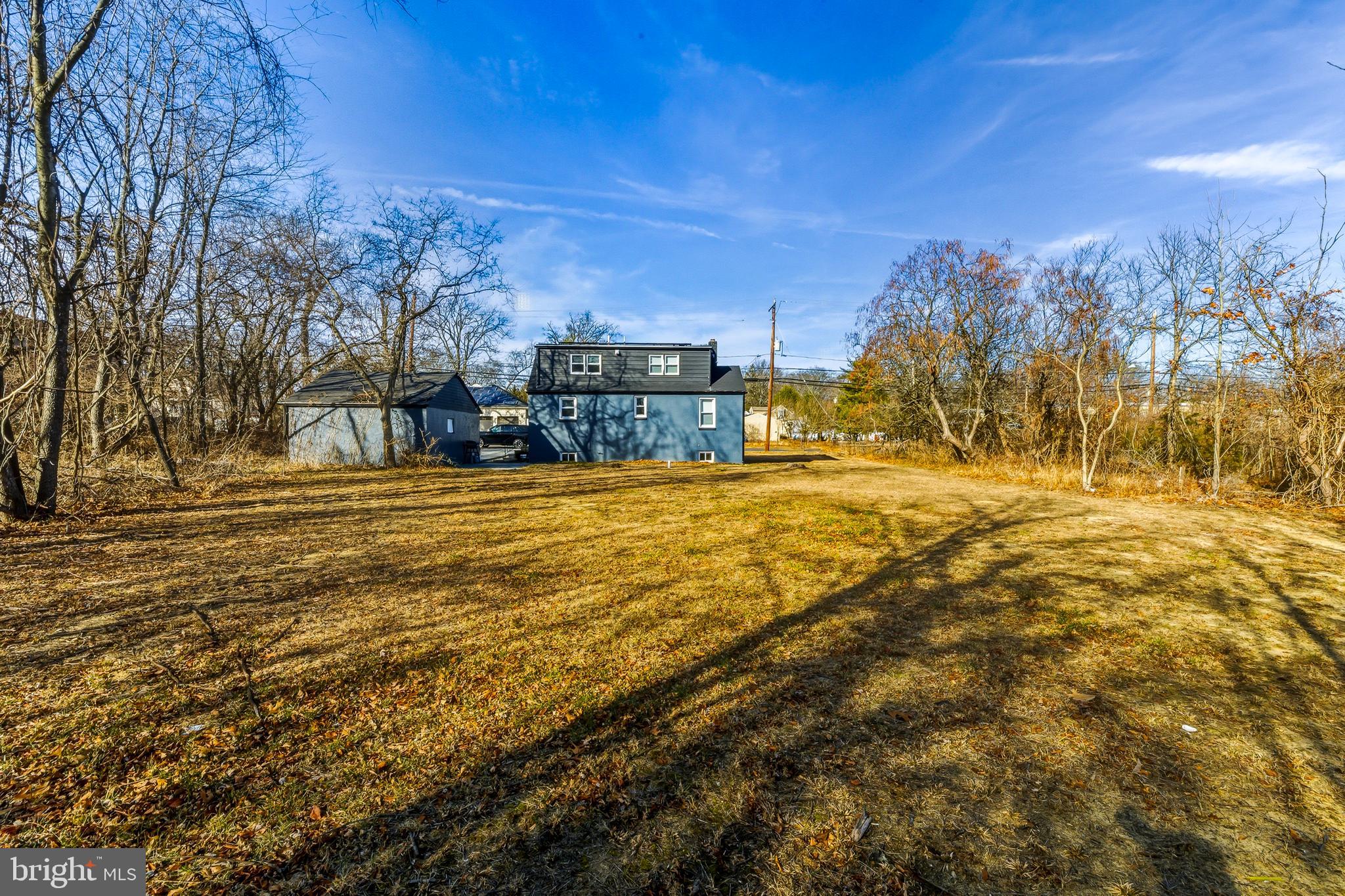 1287 Clements Bridge Road Woodbury, NJ 08096 - Photo 15 of 16 a view of a yard with a building