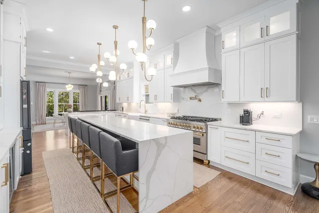 a kitchen with a sink stove and cabinets