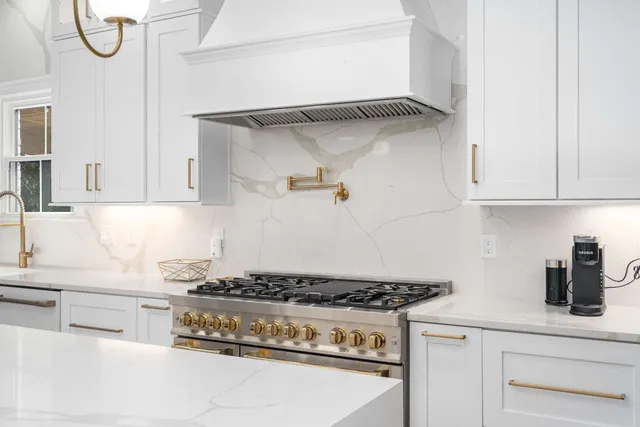 a large kitchen with a table and chairs