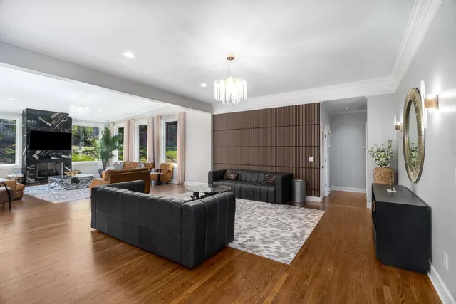 a living room with fireplace furniture and a flat screen tv