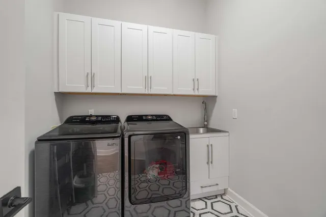 a bathroom with a shower and a sink