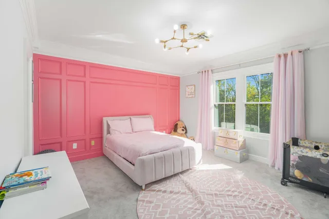 a bedroom with a bed and lamp