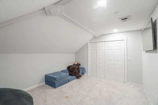 a bathroom with a shower and a sink