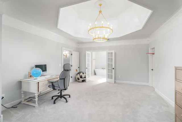 a view of a patio with couches potted plants and wooden floor