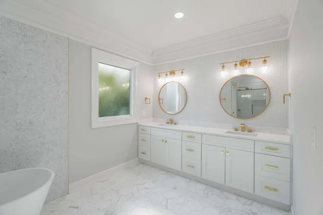 a view of a patio with table and chairs potted plants with wooden floor and fence