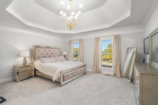 a front view of a residential apartment building with a yard