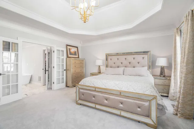 a front view of a house with a yard and green space