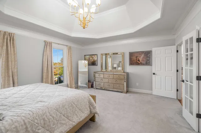 an aerial view of a house with a lake view