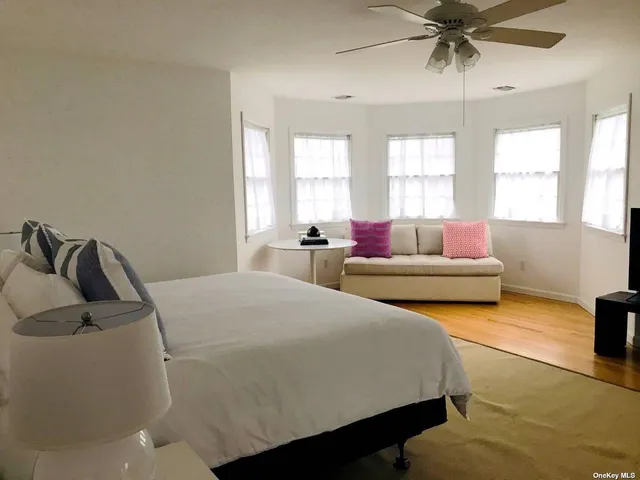 a bedroom with bed and window