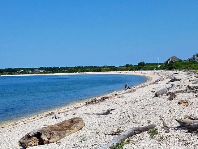 a view of an ocean beach and city