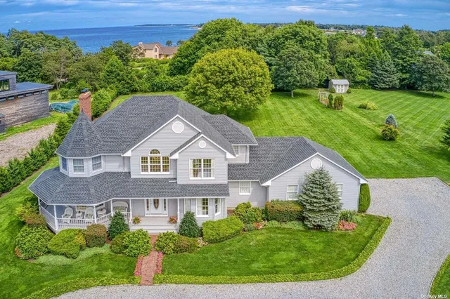 a aerial view of a house with a yard