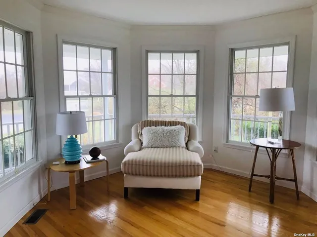 a living room with furniture and windows
