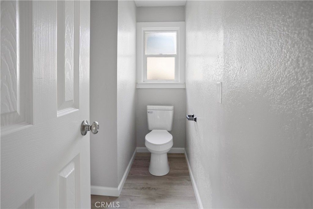 2525 R Street Merced, CA 95340 - Photo 8 of 19 a bathroom with a toilet