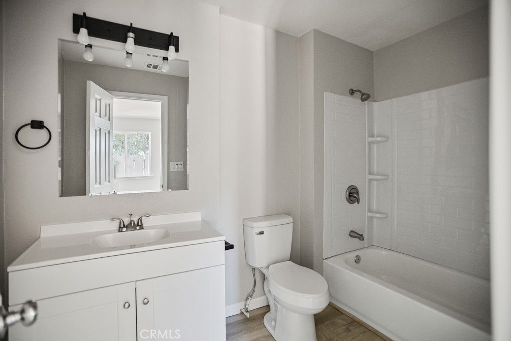 2525 R Street Merced, CA 95340 - Photo 9 of 19 a bathroom with a sink a toilet and shower