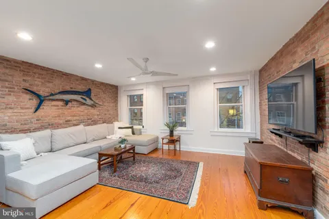 a spacious bathroom with a double vanity sink and a mirror