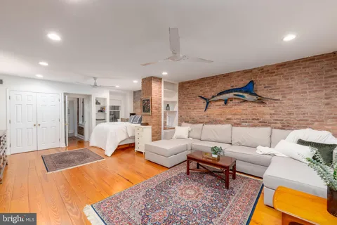 a spacious en suite bathroom with double sink and a large mirror