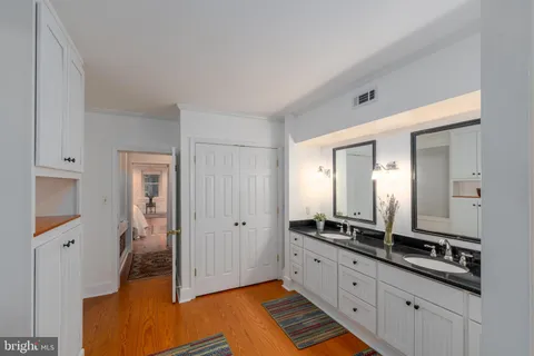 a bathroom with a sink toilet a mirror and shower