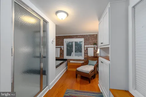 a bedroom with a bed and a view of room