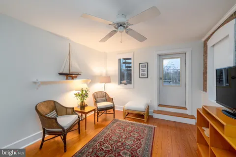 a view of a balcony with chairs