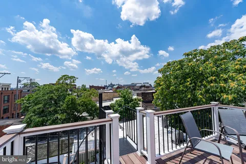 a kitchen with a sink appliances and cabinets