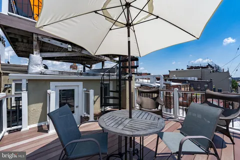 a kitchen with a sink a stove a refrigerator and a stove