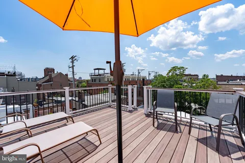 a bedroom with a bed and a television
