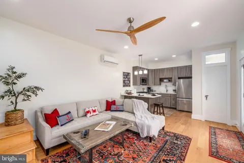 a view of a patio with table and chairs