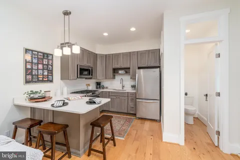 a view of a patio with table and chairs