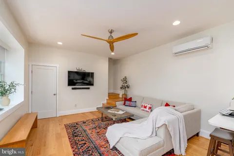 a view of a patio with table and chairs