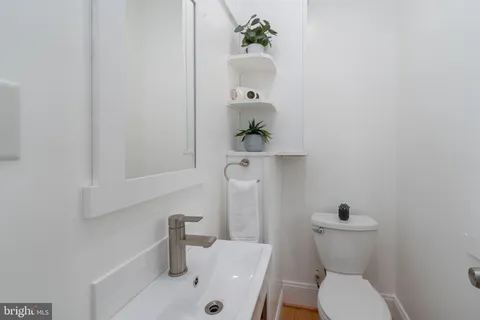 a view of a patio with couches table and chairs and potted plants