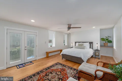 a view of a white building with a terrace