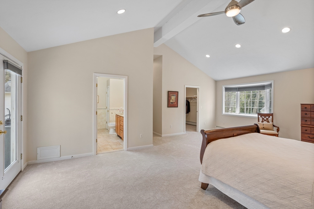 10 Lincoln Drive Acton, MA 01720 - Photo 13 of 32 a bedroom with a large bed closet and window