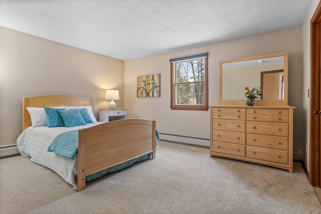 10 Lincoln Drive Acton, MA 01720 - Photo 18 of 32 a living room with furniture and a window