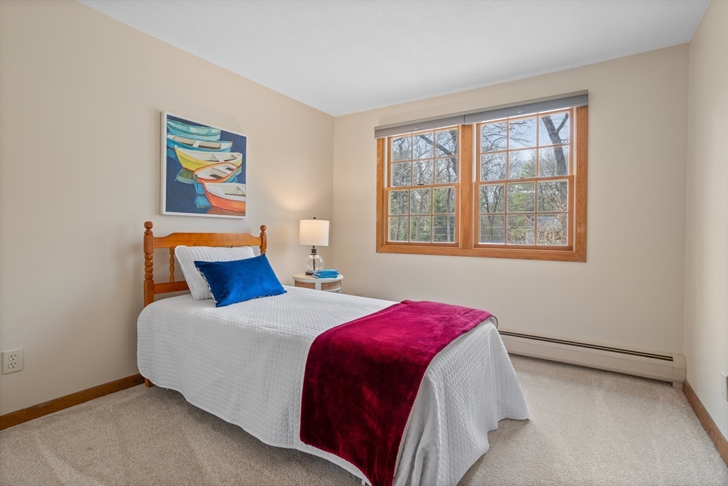 10 Lincoln Drive Acton, MA 01720 - Photo 20 of 32 a bedroom with a bed and a window