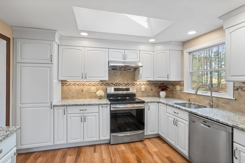10 Lincoln Drive Acton, MA 01720 - Photo 2 of 32 a kitchen with granite countertop stainless steel appliances white cabinets granite counter tops and a window