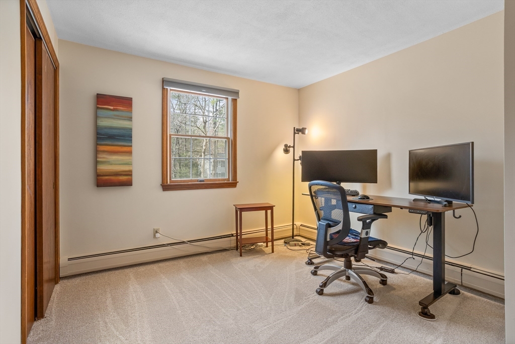 10 Lincoln Drive Acton, MA 01720 - Photo 21 of 32 a view of a workspace with furniture and a window
