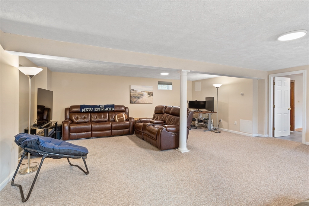 10 Lincoln Drive Acton, MA 01720 - Photo 23 of 32 a living room with furniture and a couch