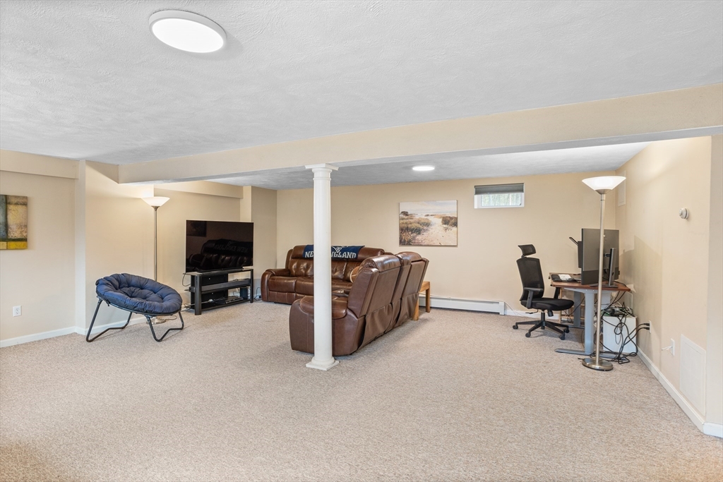 10 Lincoln Drive Acton, MA 01720 - Photo 24 of 32 a view of a livingroom with furniture and a couch