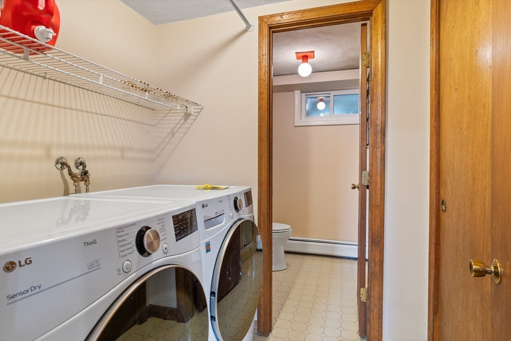 10 Lincoln Drive Acton, MA 01720 - Photo 26 of 32 a utility room with dryer and washer
