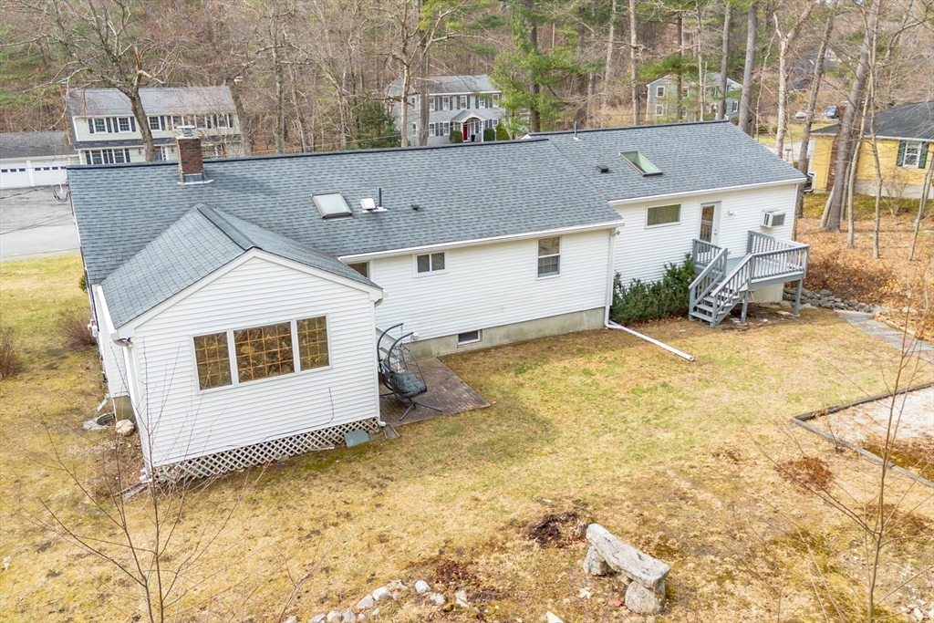 10 Lincoln Drive Acton, MA 01720 - Photo 28 of 32 an aerial view of a house with yard and seating space