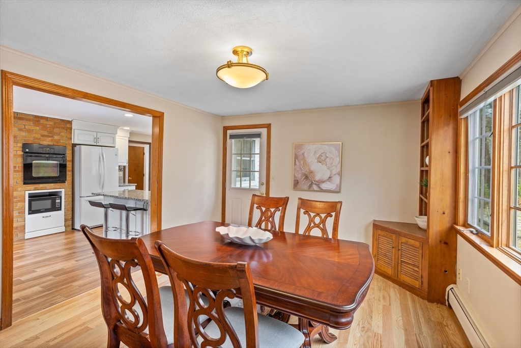 10 Lincoln Drive Acton, MA 01720 - Photo 5 of 32 a view of a dining room with furniture and wooden floor